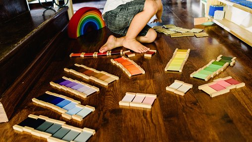Children playing and learning with montessori color tablets